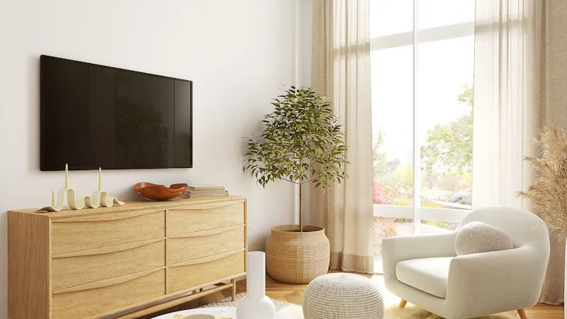 Modern flat-screen Smart TV mounted on a living room wall showing a streaming home screen